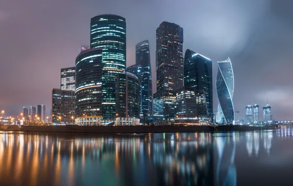 Картинка город, отражение, река, здания, дома, вечер, освещение, Москва, небоскрёбы, мегаполис, Москва-Сити, бизнес-центр